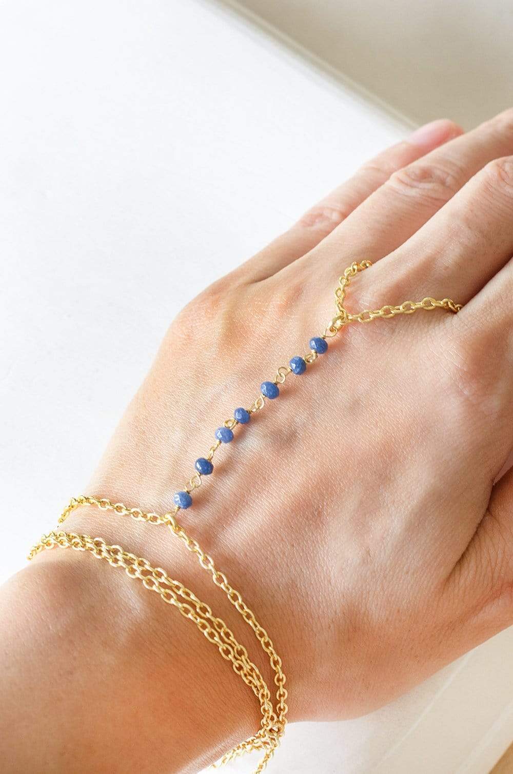 Raindrops Gold Plated Hath Phool with Blue Routile Semi Precious Stones